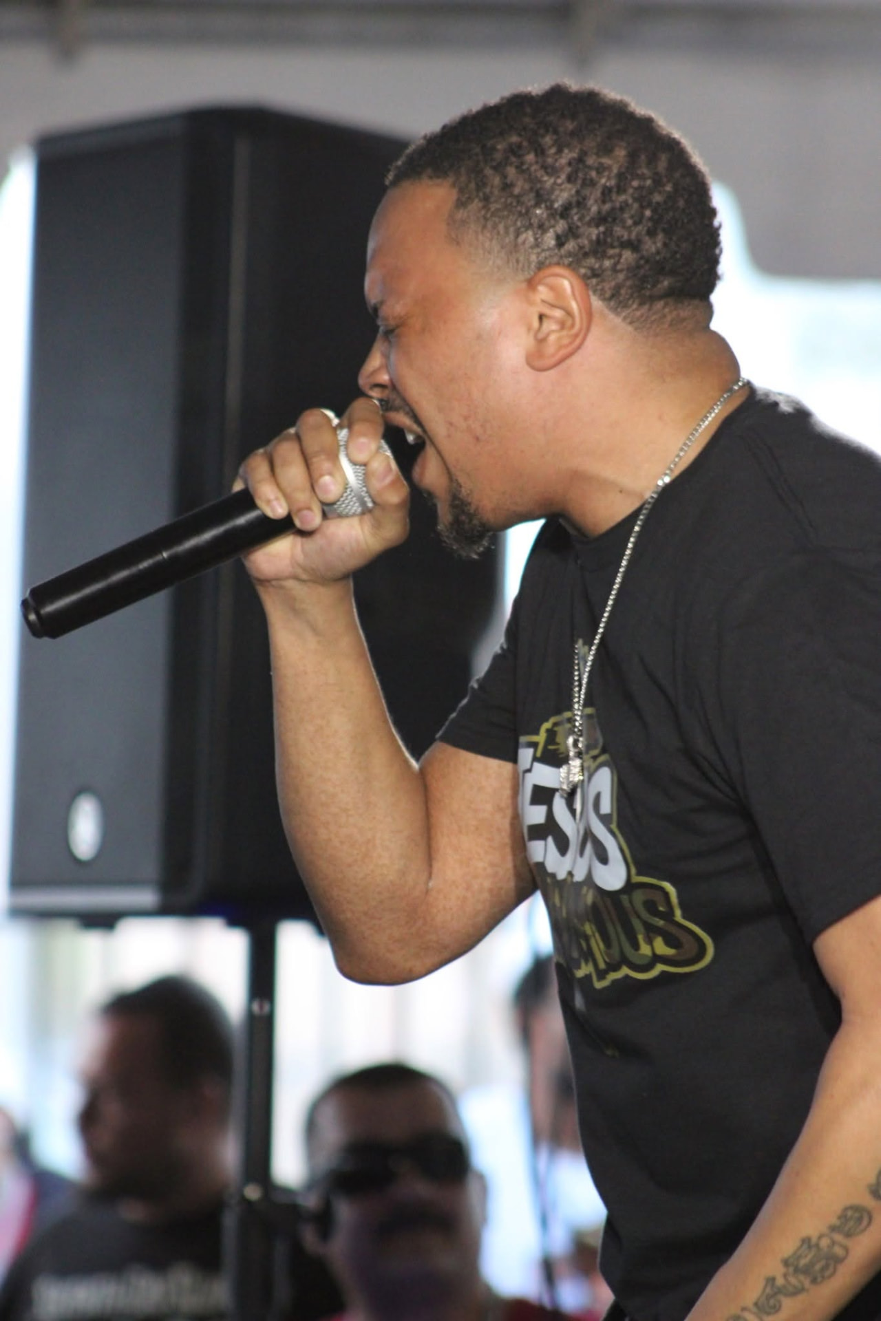 Vertical close-up of a singer during a live performance