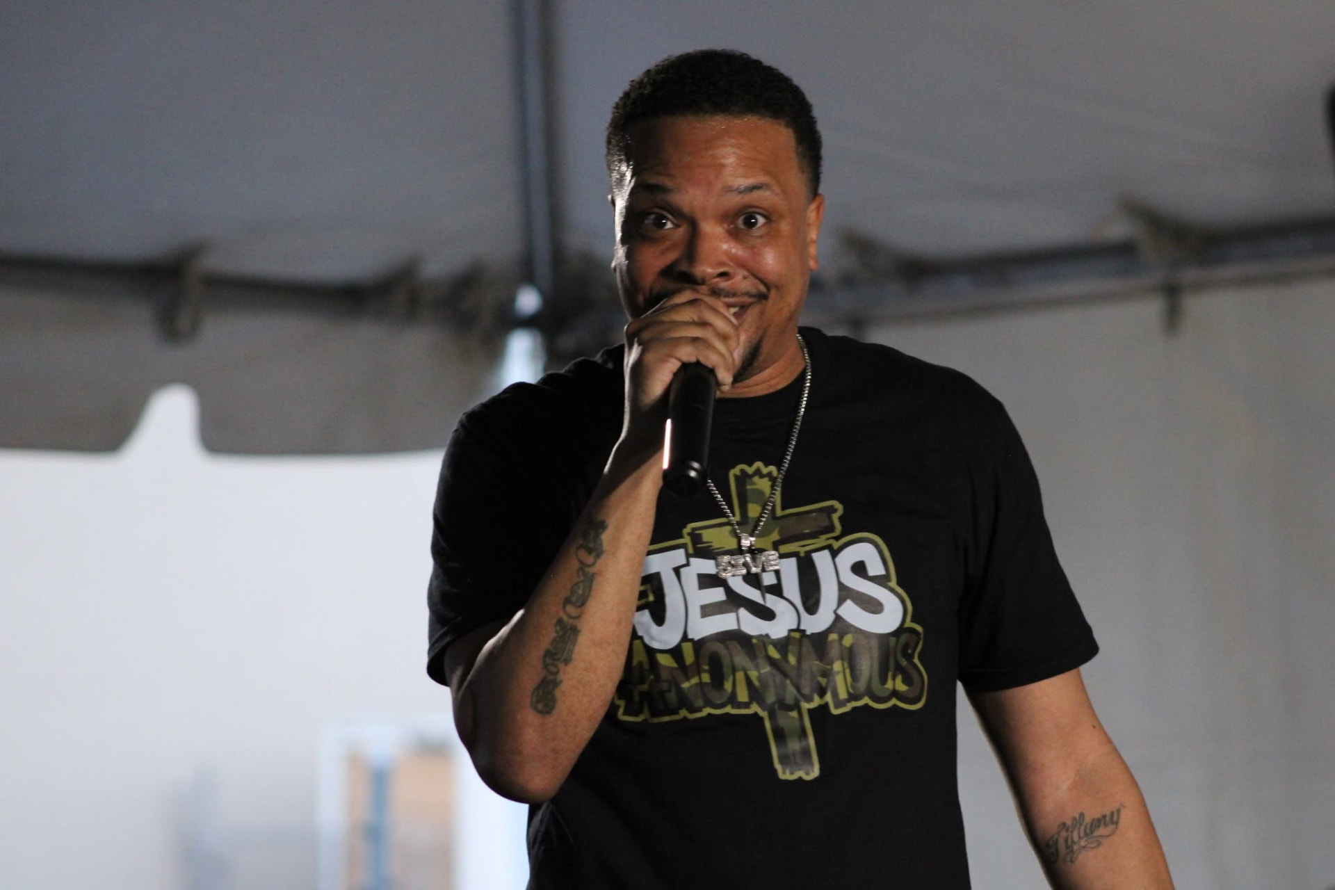Concert performer singing into a microphone